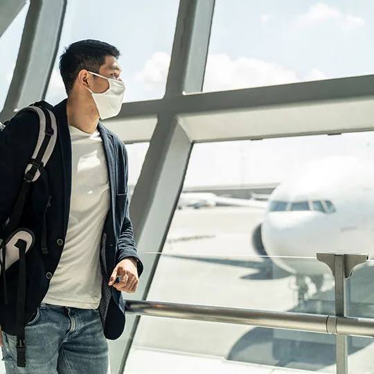 Tourist with mask in an airport