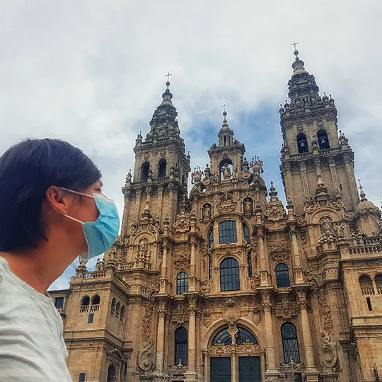 Tourist with face mask in Santiago de Compostela Cathedral