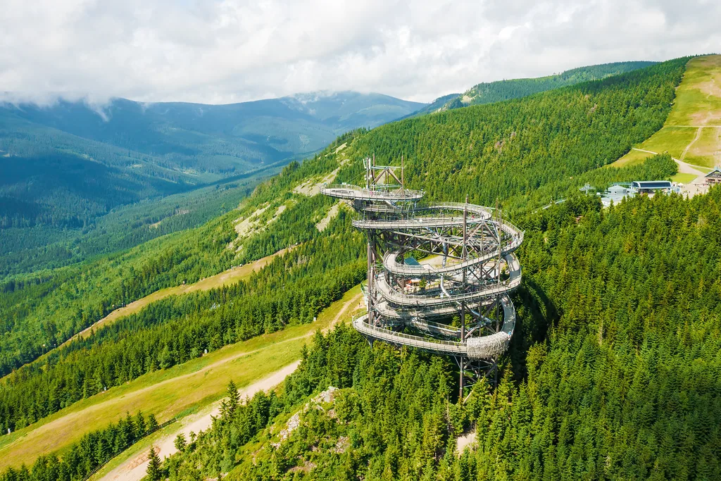 Sky walk observation tower in the forest between mountain hills near Sky Bridge 721 in a sunny summer day, Dolni Morava, Czech Republic.