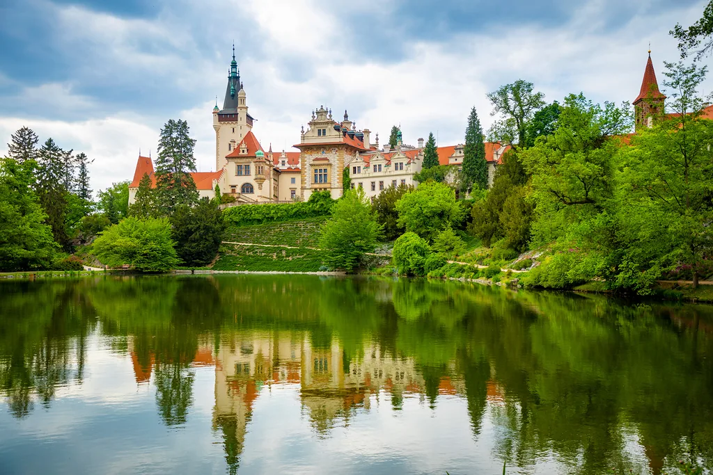 Pruhonice, Czech republic - May 19, 2020: Castle with reflection in pond in spring time, Pruhonice, Czech Republic