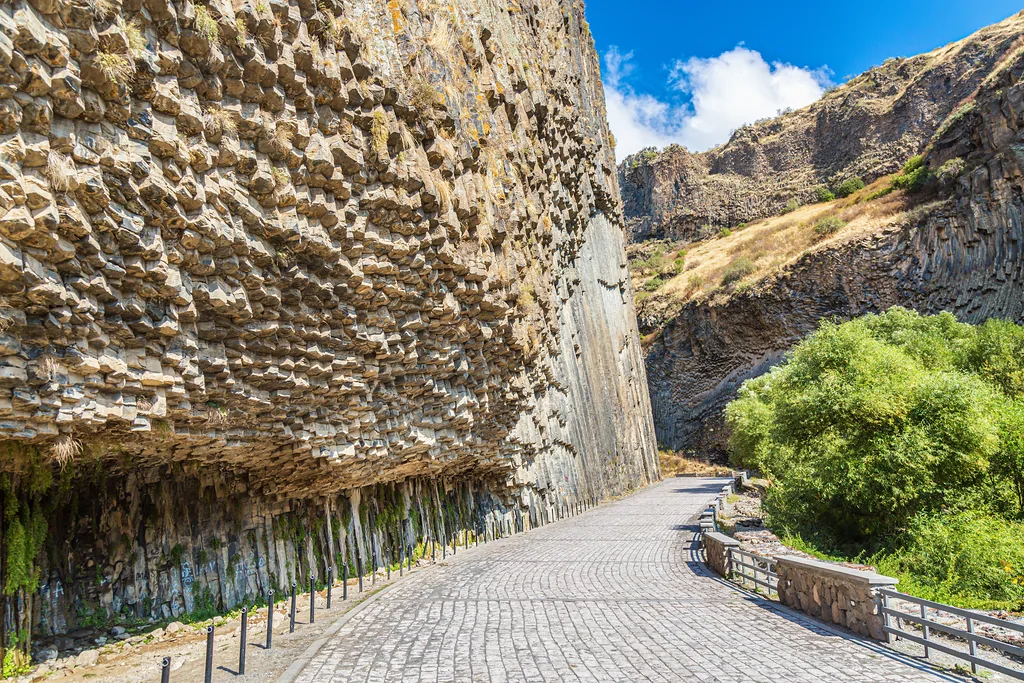 Basalt columns Symphony of Stones near the shore of the river Azat near the village Garni, Armenia.Tourism landmark in Armenia.