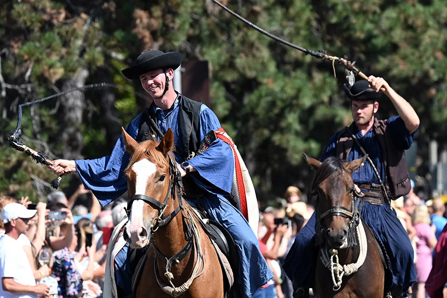 Badacsony, lake Balaton, Hungary - Sept 10, 2023 - Wine Harvest Festival parade, two traditional Hungarian Csikós horse riders with whips