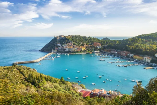 Porto Ercole village and boats in harbor in the bay. Aerial view. Monte Argentario, Maremma, province of Grosseto, Tuscany region, Italy